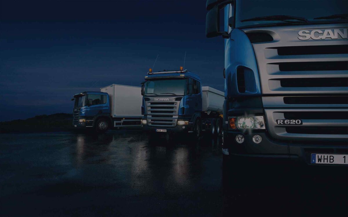 Dark-Three-trucks-on-blue-background